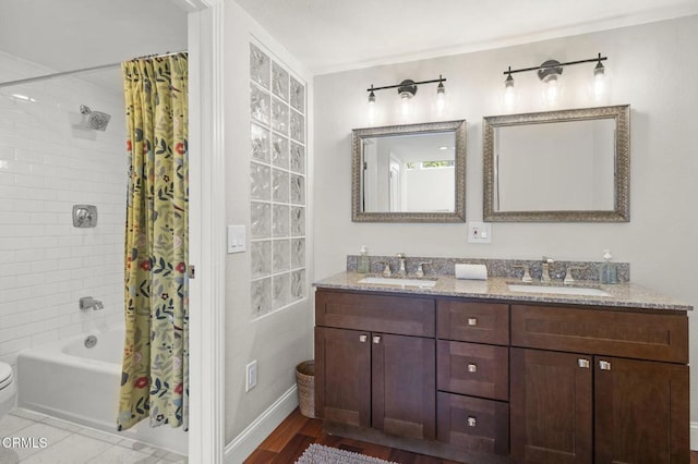 483 Broderick Way, Port Hueneme, CA 93041 - bathroom featuring double vanity, shower / bath combination with curtain, toilet, and baseboards