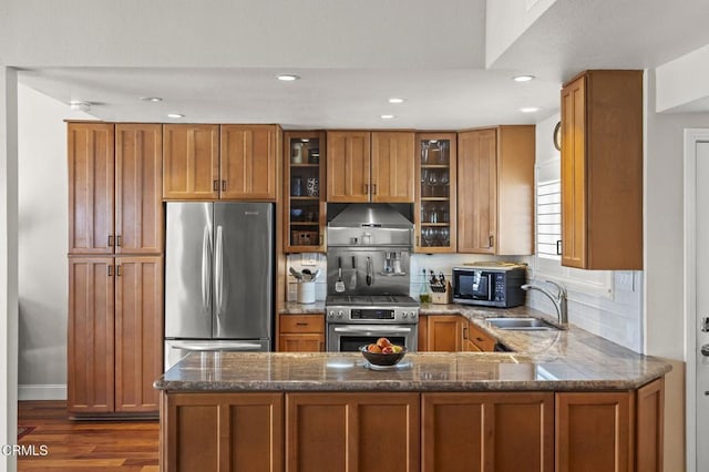 483 Broderick Way, Port Hueneme, CA 93041 - kitchen featuring stainless steel appliances, a sink, under cabinet range hood, brown cabinets, and a peninsula