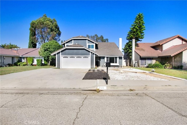 968 N Darfield Ave, Covina, CA 91724 - view of front facade with concrete driveway and a garage