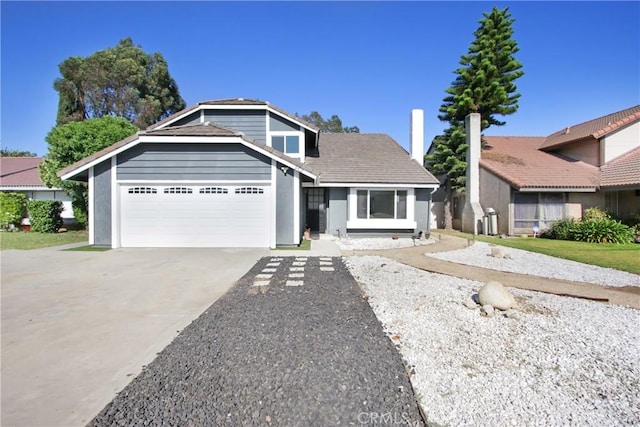968 N Darfield Ave, Covina, CA 91724 - view of front facade with a garage, concrete driveway, and stucco siding