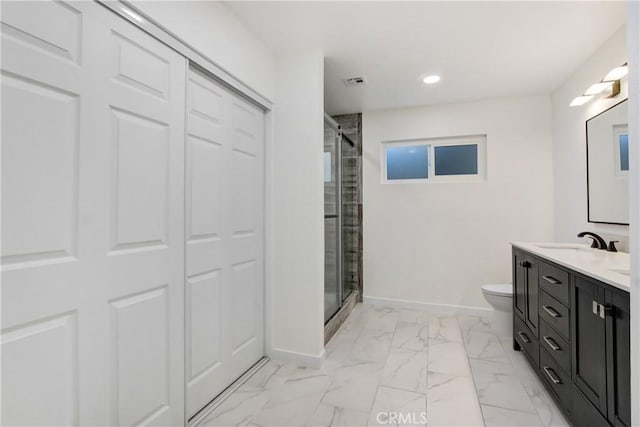968 N Darfield Ave, Covina, CA 91724 - bathroom featuring vanity, a shower stall, toilet, marble finish flooring, and baseboards
