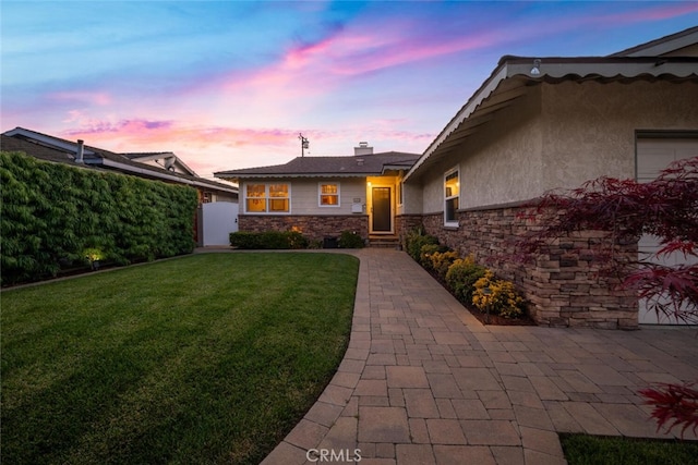 5323 Fidler Ave, Lakewood, CA 90712 - view of front of property with stone siding, stucco siding, and a chimney