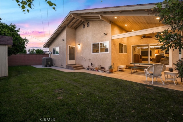 5323 Fidler Ave, Lakewood, CA 90712 - back of property at dusk with stucco siding, ceiling fan, a patio area, and central air condition unit