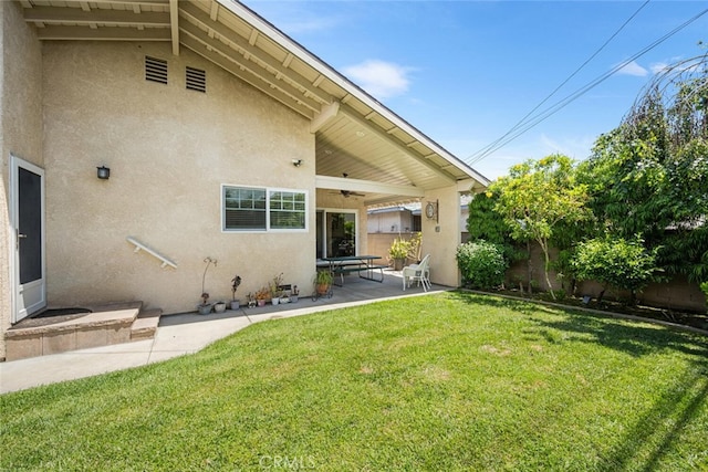 5323 Fidler Ave, Lakewood, CA 90712 - back of property featuring stucco siding, a ceiling fan, and a patio area