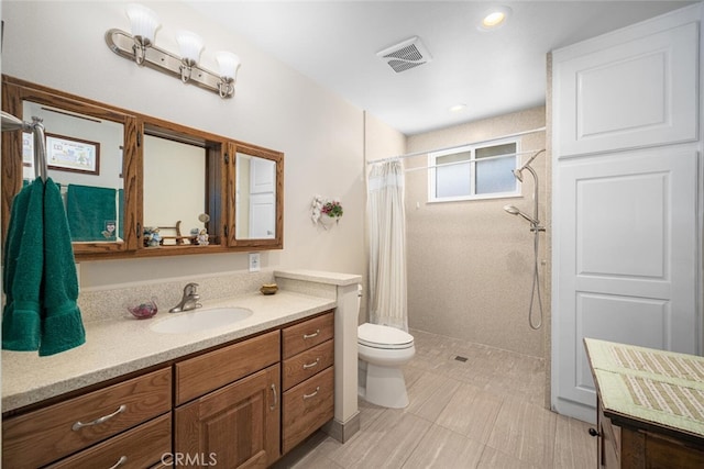 5323 Fidler Ave, Lakewood, CA 90712 - full bath featuring vanity, tiled shower, toilet, and recessed lighting