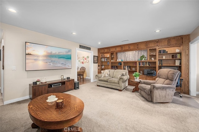 5323 Fidler Ave, Lakewood, CA 90712 - living room with light colored carpet, baseboards, and recessed lighting