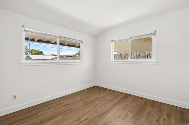 6443 Mount Ackerman Dr, San Diego, CA 92111 - spare room featuring baseboards, wood finished floors, and lofted ceiling
