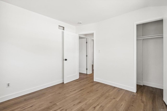 6443 Mount Ackerman Dr, San Diego, CA 92111 - unfurnished bedroom with wood finished floors, a closet, and baseboards
