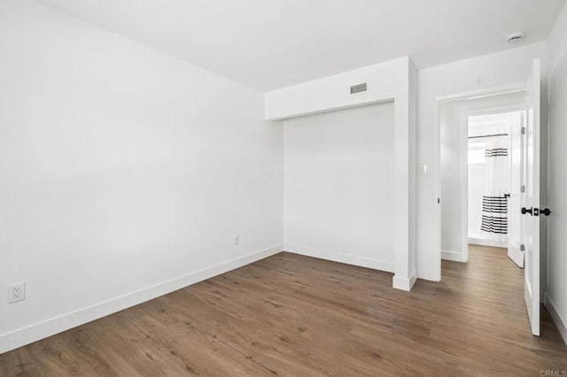 6443 Mount Ackerman Dr, San Diego, CA 92111 - unfurnished bedroom with baseboards, wood finished floors, and a closet