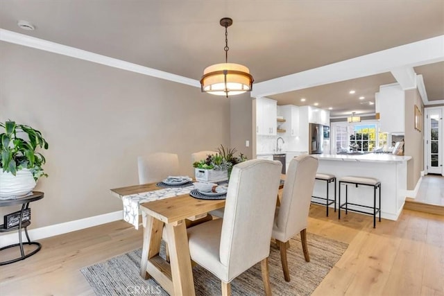 33976 Cape Cv, Dana Point, CA 92629 - dining space with ornamental molding, light wood-style floors, baseboards, and recessed lighting