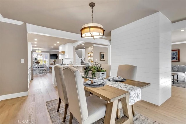 33976 Cape Cv, Dana Point, CA 92629 - dining space with light wood-style floors, crown molding, recessed lighting, stairway, and baseboards