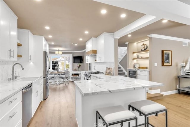 33976 Cape Cv, Dana Point, CA 92629 - kitchen featuring stainless steel appliances, open shelves, white cabinetry, recessed lighting, and beverage cooler