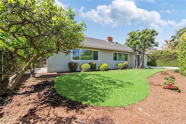 557 S Gardner Dr, Orange, CA 92866 - rear view of property with a lawn, a chimney, stucco siding, and a shingled roof