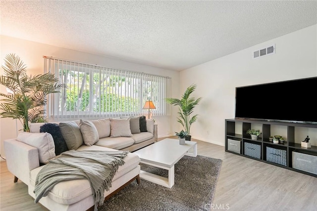 557 S Gardner Dr, Orange, CA 92866 - living room featuring wood finished floors and a textured ceiling