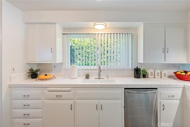 557 S Gardner Dr, Orange, CA 92866 - kitchen with dishwasher, a sink, white cabinetry, and tile counters