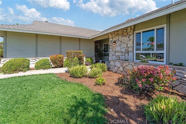 557 S Gardner Dr, Orange, CA 92866 - entrance to property with stone siding, a yard, and stucco siding