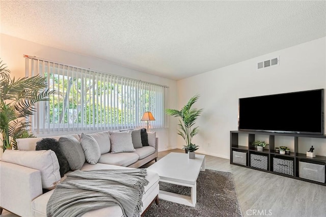 557 S Gardner Dr, Orange, CA 92866 - living area featuring wood finished floors and a textured ceiling