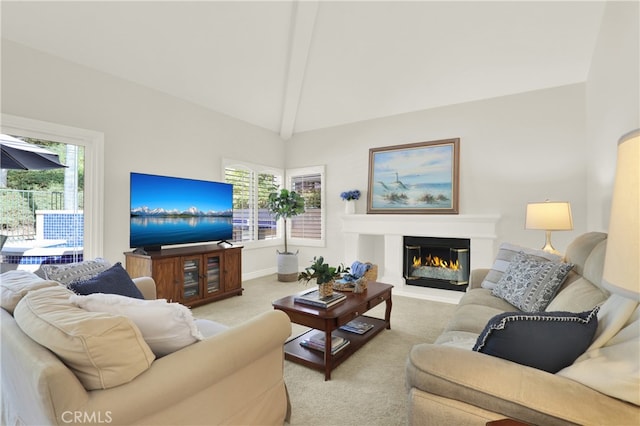 4 Westgate, Laguna Niguel, CA 92677 - carpeted living area featuring a glass covered fireplace, plenty of natural light, and baseboards