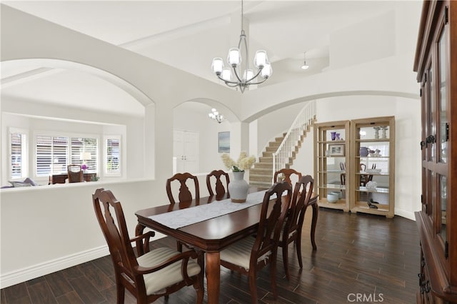 4 Westgate, Laguna Niguel, CA 92677 - dining area with a chandelier, arched walkways, dark wood-type flooring, baseboards, and vaulted ceiling