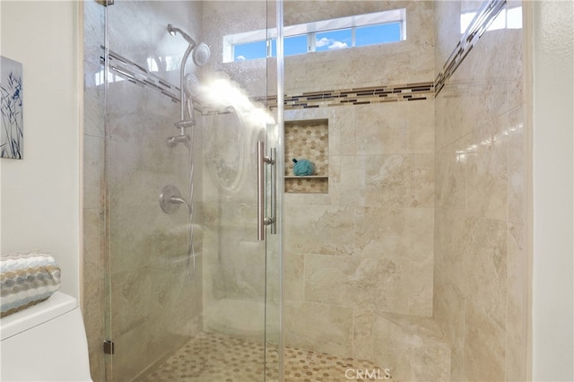 4 Westgate, Laguna Niguel, CA 92677 - bathroom featuring a stall shower, toilet, and healthy amount of natural light