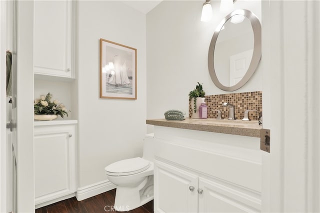 4 Westgate, Laguna Niguel, CA 92677 - bathroom with vanity, tasteful backsplash, toilet, wood finished floors, and baseboards