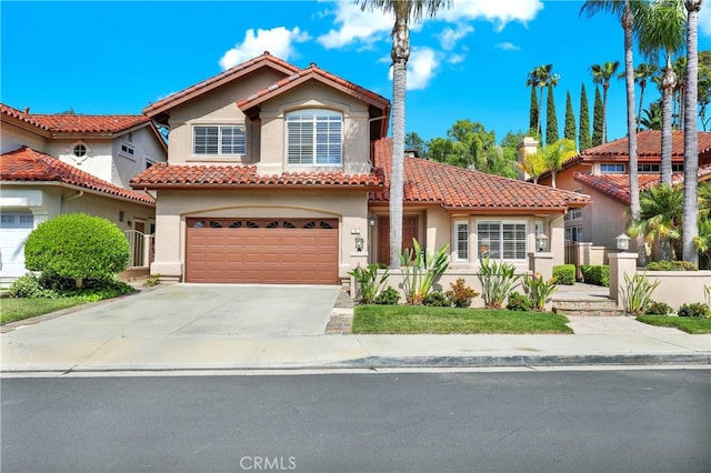 4 Westgate, Laguna Niguel, CA 92677 - mediterranean / spanish home featuring a tiled roof, an attached garage, and stucco siding