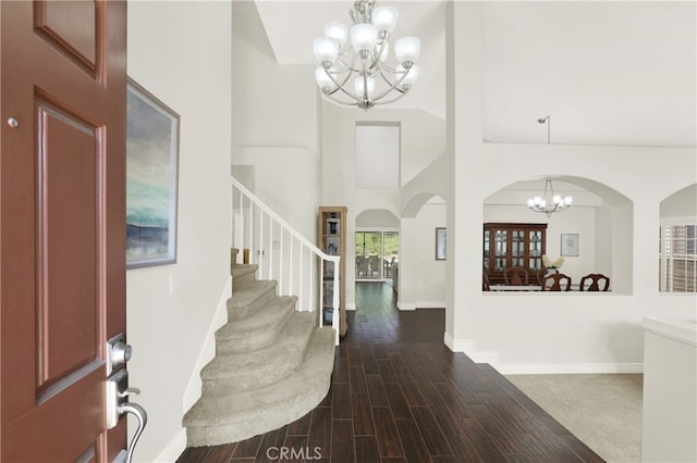 4 Westgate, Laguna Niguel, CA 92677 - foyer entrance with a chandelier, arched walkways, stairs, baseboards, and a towering ceiling