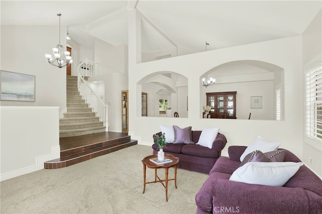 4 Westgate, Laguna Niguel, CA 92677 - carpeted living room with a chandelier, stairs, arched walkways, and high vaulted ceiling