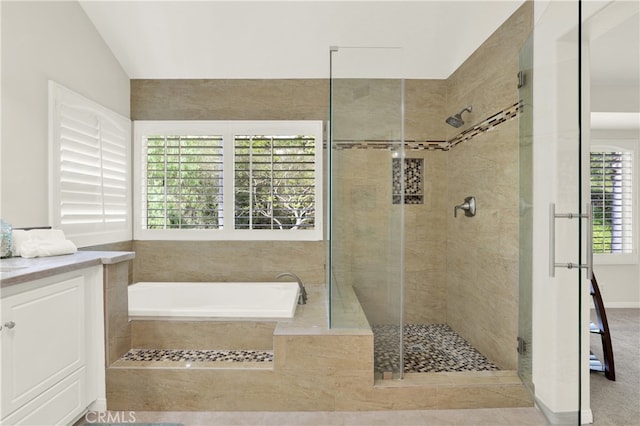 4 Westgate, Laguna Niguel, CA 92677 - full bathroom featuring a garden tub, a shower stall, lofted ceiling, and vanity