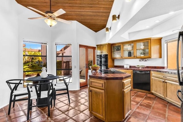 24155 Vis D Onde, Dana Point, CA 92629 - kitchen featuring black appliances, tile counters, brown cabinetry, wooden ceiling, and glass insert cabinets