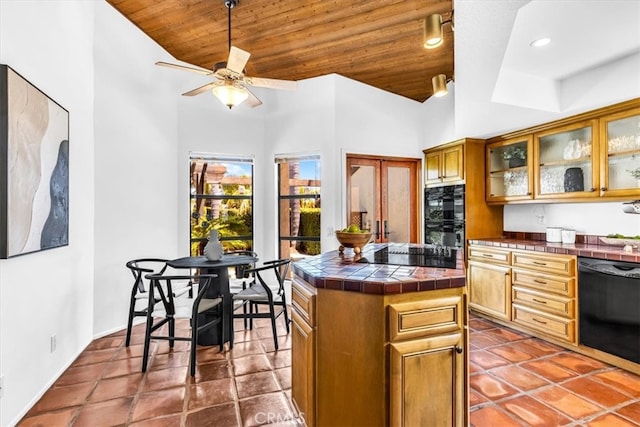 24155 Vis D Onde, Dana Point, CA 92629 - kitchen with tile countertops, wooden ceiling, black appliances, a ceiling fan, and glass insert cabinets