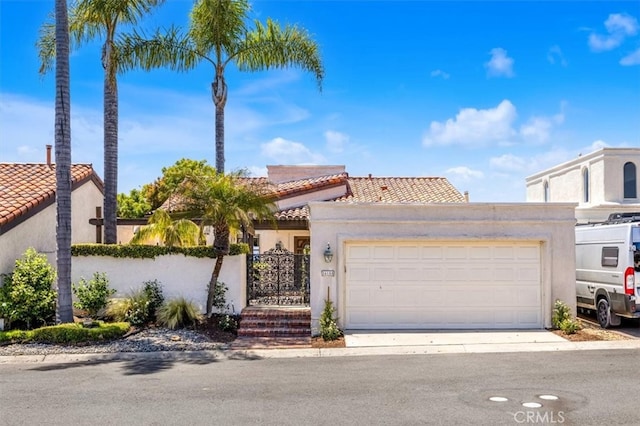 24155 Vis D Onde, Dana Point, CA 92629 - view of front of home with a tiled roof, stucco siding, a garage, and driveway
