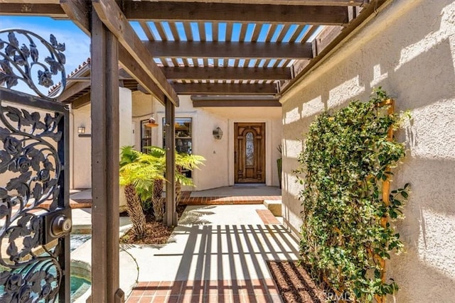 24155 Vis D Onde, Dana Point, CA 92629 - doorway to property with stucco siding and a pergola