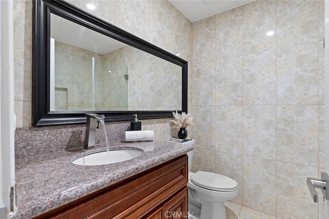 4906 W 5th St Unit C, Santa Ana, CA 92703 - full bath with vanity, toilet, tile walls, and tile patterned floors