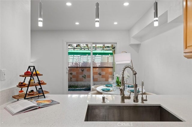 4906 W 5th St Unit C, Santa Ana, CA 92703 - kitchen view of a sink, recessed lighting, light stone countertops, and hanging light fixtures