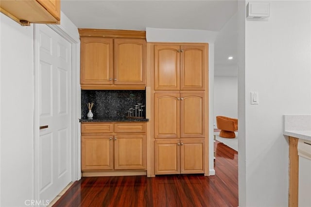 4906 W 5th St Unit C, Santa Ana, CA 92703 - kitchen featuring dark wood-style flooring, backsplash, dark stone counters, and recessed lighting