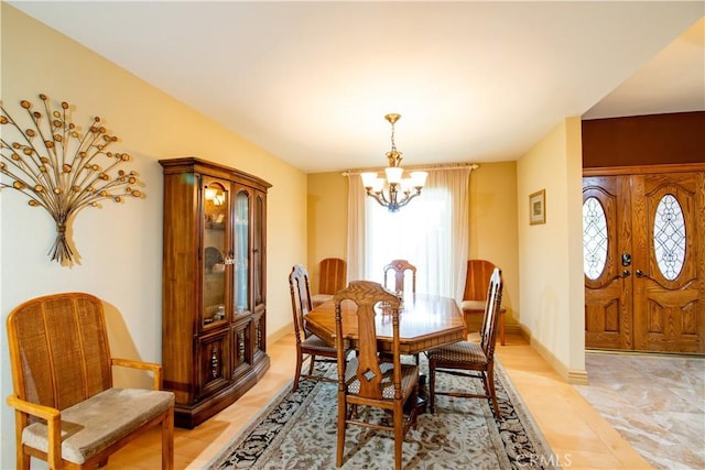 21357 Bermuda St, Chatsworth, CA 91311 - dining room featuring a chandelier and baseboards
