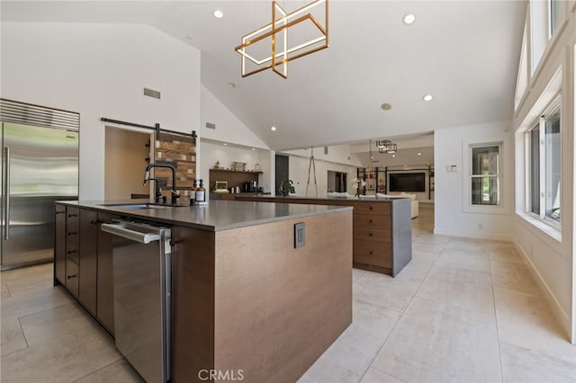 10372 Crawford Canyon Rd, North Tustin, CA 92705 - kitchen with a spacious island, appliances with stainless steel finishes, modern cabinets, a sink, and high vaulted ceiling