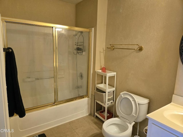 1174 Greene Ter, Davis, CA 95618 - full bathroom featuring toilet, vanity, shower / bath combination with glass door, tile patterned floors, and a textured wall