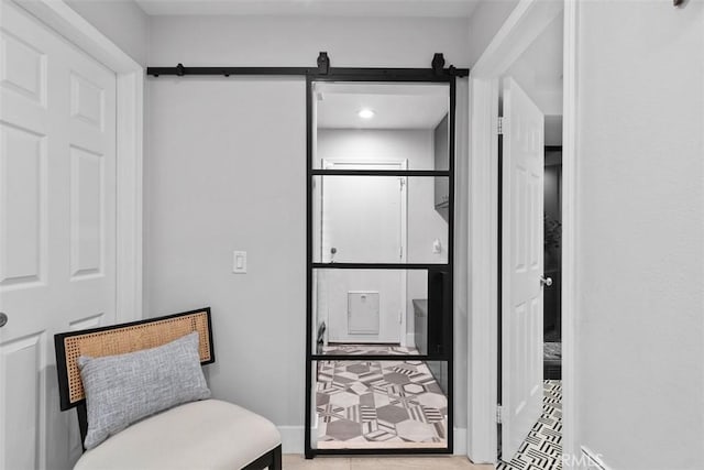 12 Argos, Laguna Niguel, CA 92677 - sitting room featuring baseboards, a barn door, and tile patterned floors