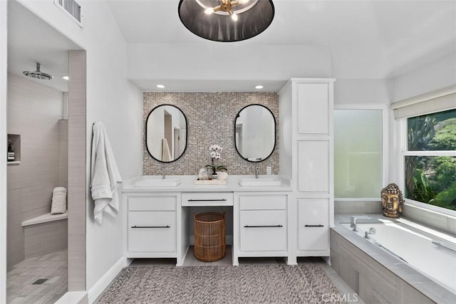 12 Argos, Laguna Niguel, CA 92677 - bathroom featuring a garden tub, double vanity, tiled shower, and recessed lighting