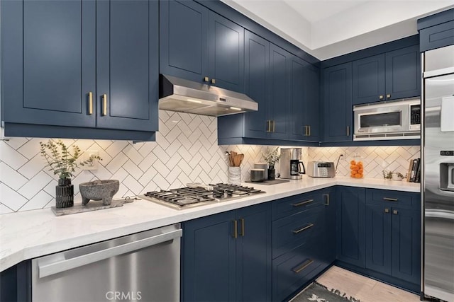12 Argos, Laguna Niguel, CA 92677 - kitchen featuring blue cabinetry, under cabinet range hood, and built in appliances