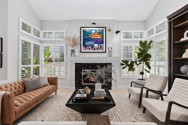 12 Argos, Laguna Niguel, CA 92677 - living area featuring a high end fireplace, lofted ceiling, and baseboards