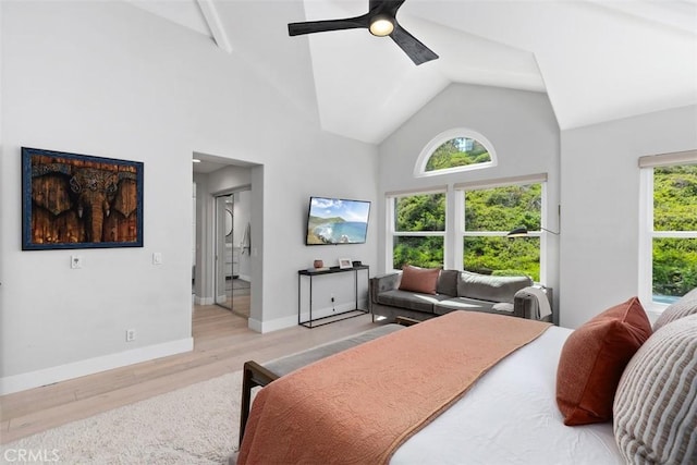 12 Argos, Laguna Niguel, CA 92677 - bedroom featuring light wood-type flooring, high vaulted ceiling, baseboards, ceiling fan, and connected bathroom