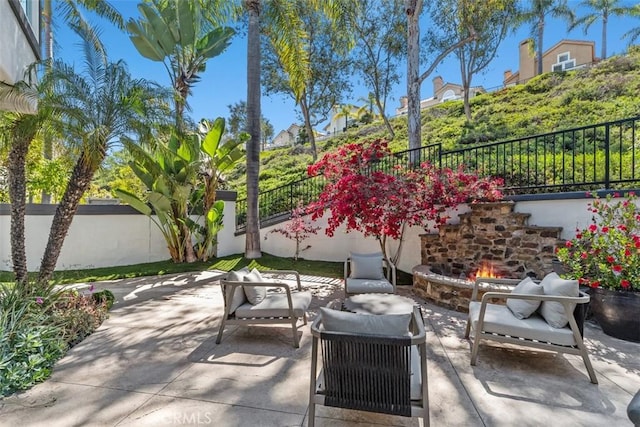 12 Argos, Laguna Niguel, CA 92677 - fenced backyard with a patio and an outdoor living space with a fireplace