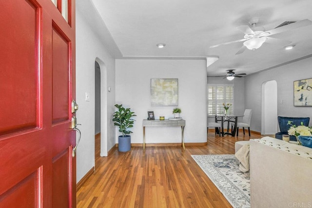4719 Constance Dr, San Diego, CA 92115 - entrance foyer featuring arched walkways, a ceiling fan, baseboards, and wood finished floors