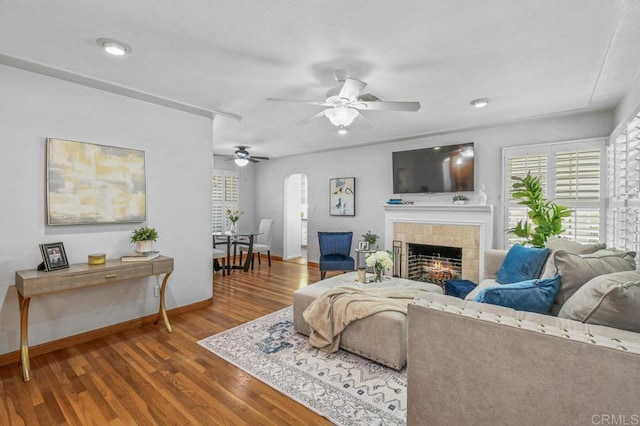 4719 Constance Dr, San Diego, CA 92115 - living room featuring a tiled fireplace, healthy amount of natural light, a ceiling fan, baseboards, and recessed lighting