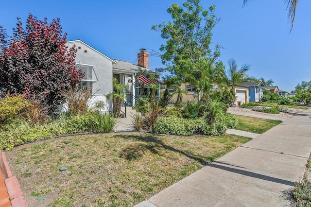 4719 Constance Dr, San Diego, CA 92115 - view of front of house with a chimney, a front yard, stucco siding, a residential view, and concrete driveway