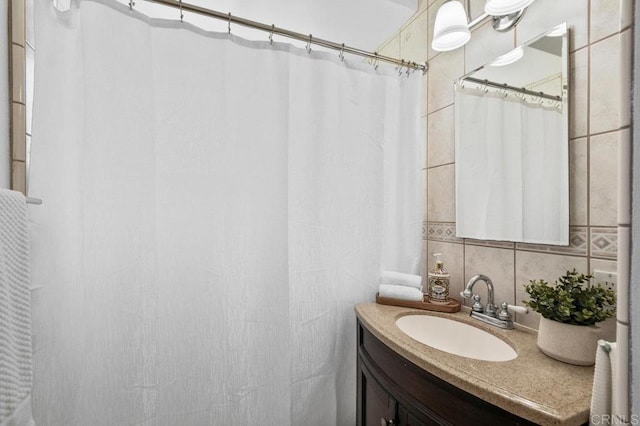 4719 Constance Dr, San Diego, CA 92115 - full bathroom featuring tile walls, vanity, backsplash, and a shower with shower curtain