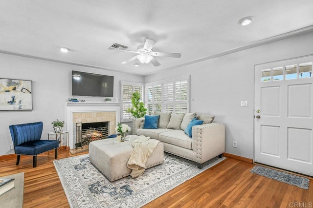 4719 Constance Dr, San Diego, CA 92115 - living room with a tile fireplace, a ceiling fan, wood finished floors, and baseboards